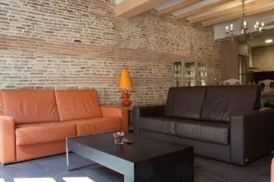 a living room with two couches and a coffee table at EL born - spacious 2 bedrooms in Barcelona