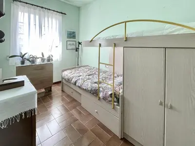 a bedroom with a bunk bed and a sink at Casa Annie in Collbató