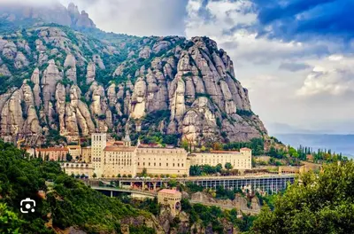 a view of a mountain with a train in front of it at Casa Annie in Collbató