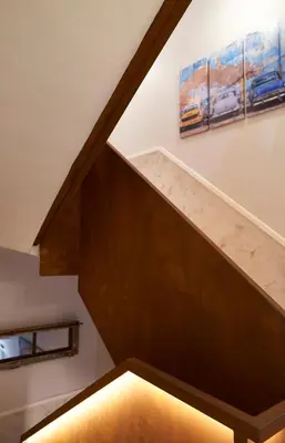 a staircase in a house with a painting on the wall at Urban Sabadell 2 in Sabadell