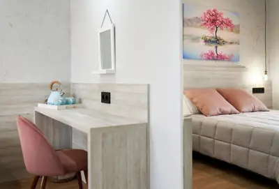 a living room with a desk and a bed at Urban Sabadell 2 in Sabadell