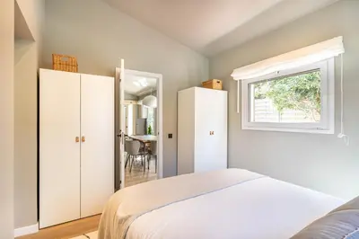 a bedroom with a bed and a window at Villa Atardecer in Barcelona