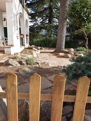 two wooden fences in front of a house at La Garsa in Aiguafreda