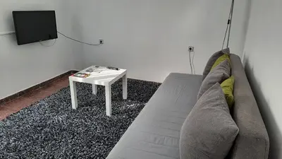 a living room with a couch and a table at La Garsa in Aiguafreda