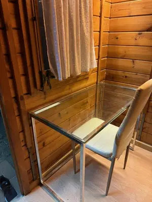 a room with a wooden wall with wooden shelves at Cool Bungalow in Matadepera