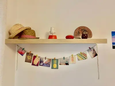 a shelf with christmas cards and other decorations on it at Apartamento Sant Josep in Canet de Mar