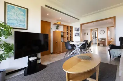 a living room with a large flat screen tv on a wall at Lets Holidays Apartment Sea Views in Barcelona in Barcelona