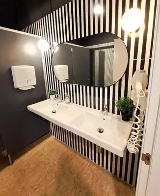 a bathroom with a white sink and a mirror at Bed & Bike Barcelona in Barcelona
