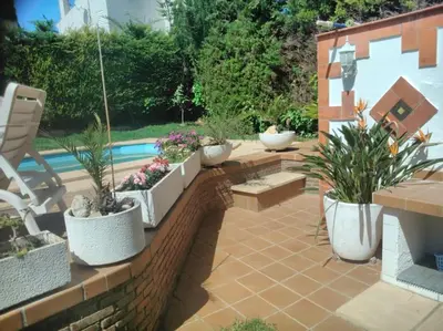 a small kitchen with a sink and a window at Beach villa with pool and near BCN & TGN in Cunit