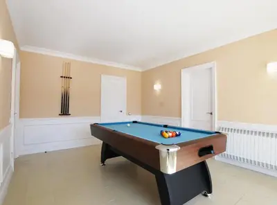 a room with a pool table in it at Torre Vendrell con Padel in Sant Pere de Vilamajor