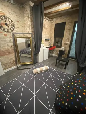 a living room with a mirror and a couch at Room not shared center liceu ramblas plaza Cataluña in Barcelona