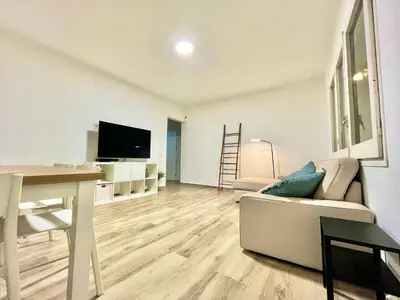 a living room with a couch and a table at Holiday Beach Home Rincón del Mar in Cunit