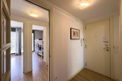 a hallway with a door leading to a living room at The Lonely Chimney Apartments in Barcelona