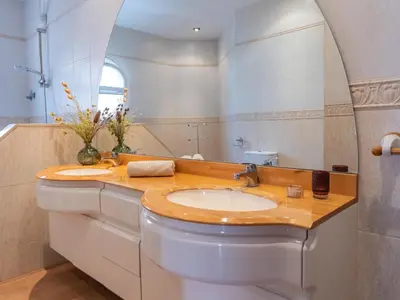 a bathroom with a sink and a mirror at Casa Serenidad: Naturaleza, Jacuzzi & Parking en Cubelles - ES-332-10 in Cubelles