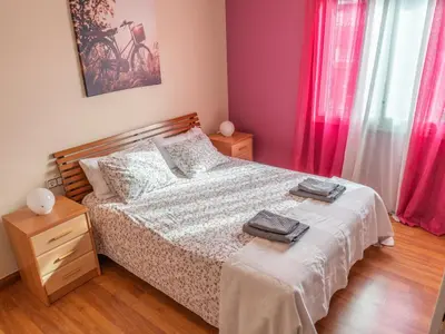 a bedroom with a bed with two towels on it at Casa Serenidad: Naturaleza, Jacuzzi & Parking en Cubelles - ES-332-10 in Cubelles