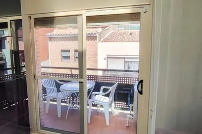 a view of a balcony with a table and chairs at Fee4Me Comfortable flat near the sea in Sant Adria de Besos