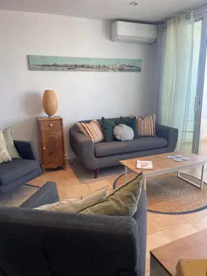 a living room with two couches and a coffee table at Viva Sitges - Sitges View in Sitges