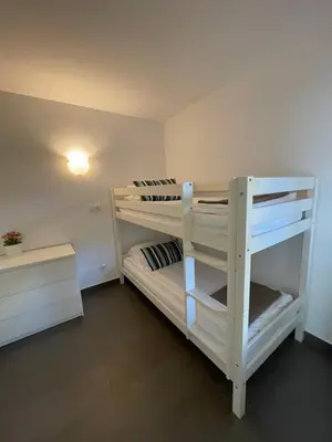 a bedroom with two bunk beds in a room at Viva Sitges - Sitges View in Sitges