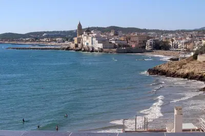 a view of a beach with people in the water at Viva Sitges - Sitges View in Sitges