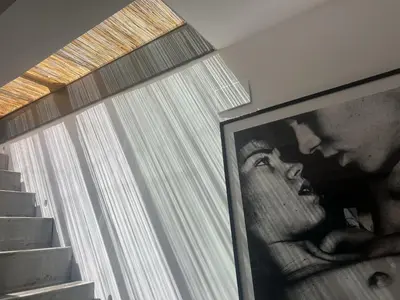 a picture of a man and a woman in front of a window at Outdoor Bathtub! 360 Rooftop with Chill Out and Amazing Views! in Barcelona