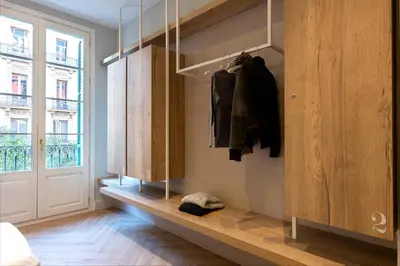 a dressing room with a shelf and a window at Weflating Boutique Hostel in Barcelona