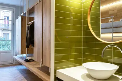 a bathroom with a sink and a mirror at Weflating Boutique Hostel in Barcelona