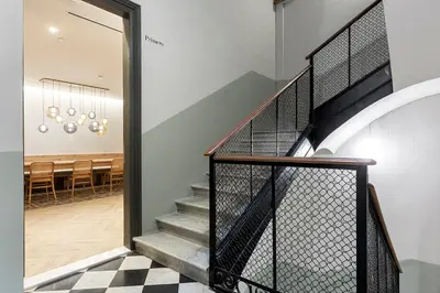 a staircase leading to the dining room of a house at Weflating Boutique Hostel in Barcelona