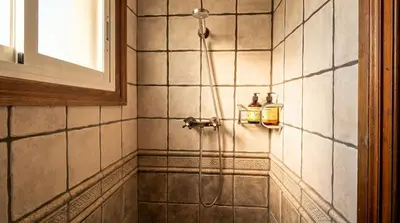 a bathroom with a white toilet and a window at Villa Abu Lita 3 minutos andando playa Renovada Piscina y Jardin XXL Autentico lujo in Sitges