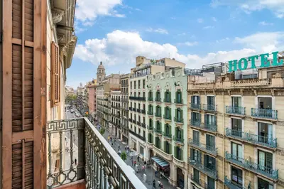 a view of a city street from a balcony at Flateli Pelayo H2 in Barcelona