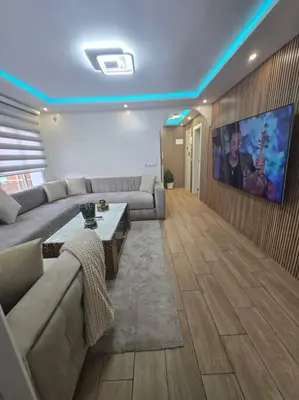 a living room with a couch and a tv at Alojamiento Entero Moderno En Barcelona Terrassa in Terrassa