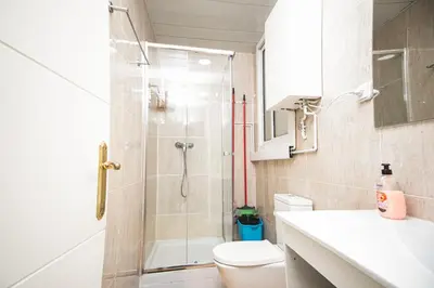 a bathroom with a shower and a toilet and a sink at Casa a pasos de Las Ramblas in Barcelona