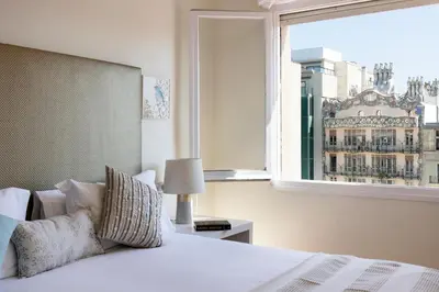 a bedroom with a bed and a large window at Stay U-nique Apartments Rambla Catalunya in Barcelona