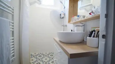 a bathroom with a large white bowl sink on a counter at Bien en exclusivité in El Prat de Llobregat