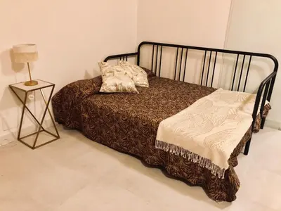 a bed in a room with a lamp on a table at Magic Apartment with Private Terrace in Barcelona