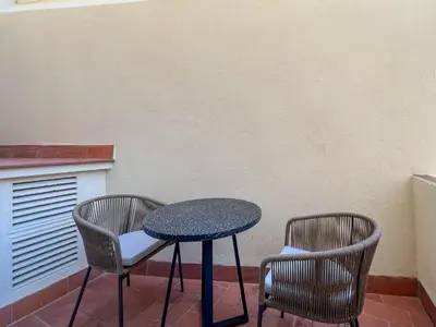 a table and two chairs on a patio at Stay U-nique Apartment Castanyer in Barcelona
