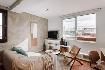 a living room with a couch and a table at Casa Ciudadela in Barcelona