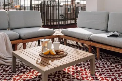 a living room with two couches and a coffee table at Casa Ciudadela in Barcelona