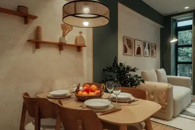 a dining room with a table with a bowl of fruit at Casa Duran in Barcelona