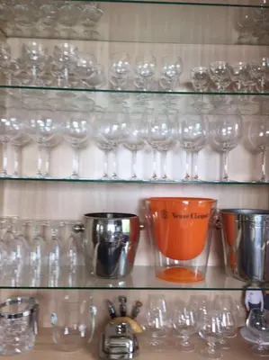 a bunch of glasses on a shelf above a sink at House Seaviews Barcelona 22Km in Cabrils