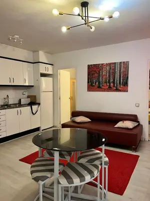 a living room with a table and a couch at Triumf in Barcelona