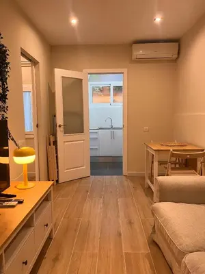 a living room with a couch and a table at MAB1 - Apartamento a pie de calle con terraza privada in Barcelona