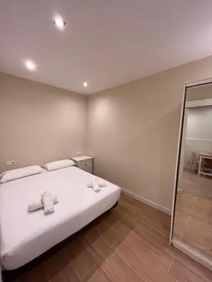 a bedroom with a bed with two towels on it at MAB1 - Apartamento a pie de calle con terraza privada in Barcelona