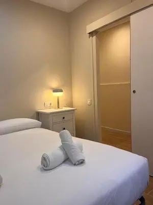 a bedroom with a bed with a towel on it at MAB1 - Apartamento a pie de calle con terraza privada in Barcelona