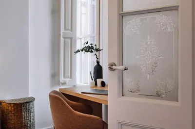 a room with a door with a table and chairs at Casa Jordi in Barcelona