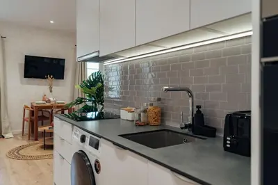 a kitchen with a sink and a counter top at Casa Laietana in Barcelona