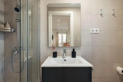 a bathroom with a sink and a shower at Casa Laietana in Barcelona
