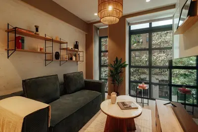 a living room with a couch and a table at Casa Macaya in Barcelona