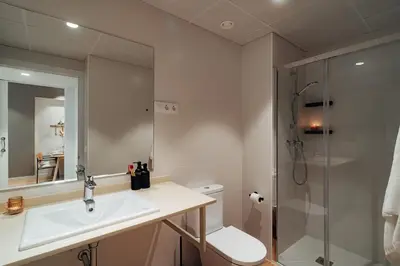 a bathroom with a sink and a shower at Casa Macaya in Barcelona