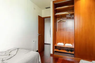 a bedroom with a wooden closet and a bed at Canela Homes BARCELONA ATIC in Barcelona