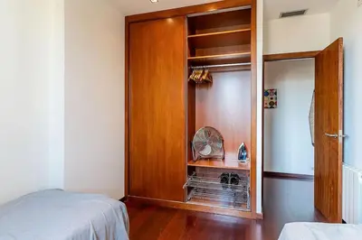 a bedroom with a wooden door and a closet at Canela Homes BARCELONA ATIC in Barcelona